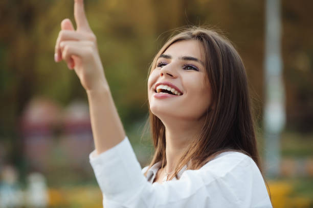 istock Happy girl catches soap bubbles 1028457666