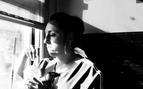 istock woman on a train, black and white portrait 1028457992