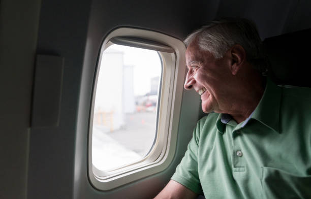 Senior man traveling by plane
