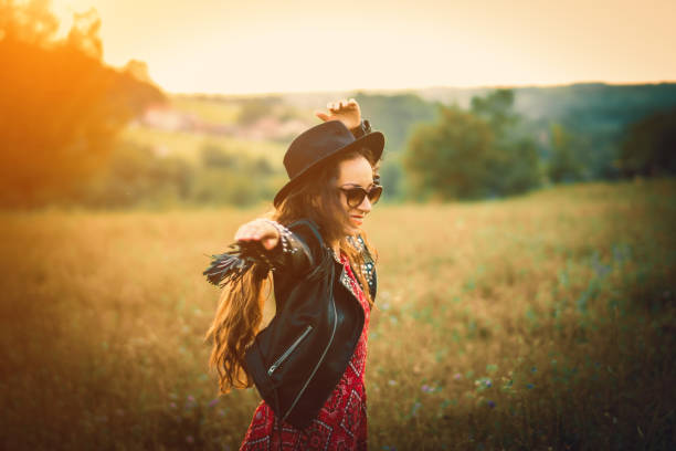 istock happy boho woman enjoying in the nature 1028477334