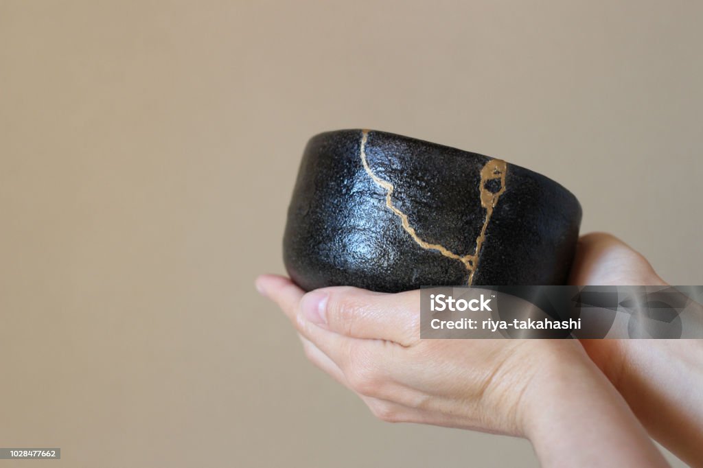 Repair of crack pottery tea cup and tea utensils Japanese tea ceremony scenes at traditional Japanese room Kintsugi Stock Photo