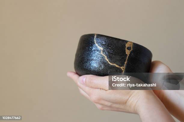 Repair Of Crack Pottery Tea Cup And Tea Utensils Stock Photo - Download Image Now - Kintsugi, Pottery, Hand