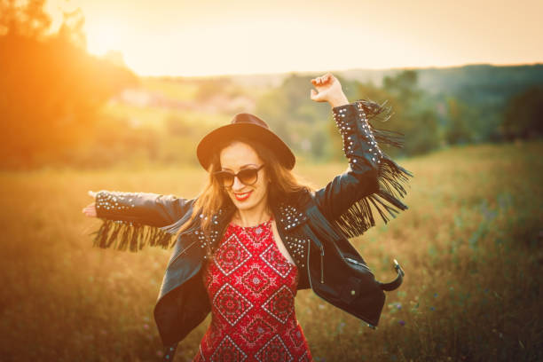 istock happy boho woman enjoying in the nature 1028477784