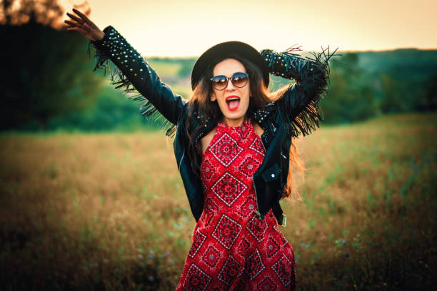 istock happy boho woman enjoying in the nature 1028477796