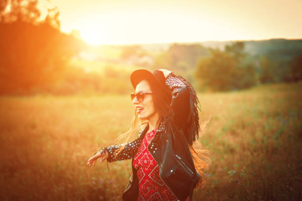 istock happy boho woman enjoying in the nature 1028477798