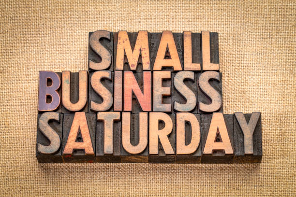 Small Business Saturday in wood type Small Business Saturday word abstract - text in vintage letterpress wood type against burlap canvas, holiday shopping concept printing block photos stock pictures, royalty-free photos & images