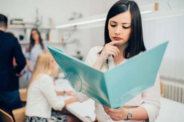 istock Young woman working with her colleagues in the office 1028484164