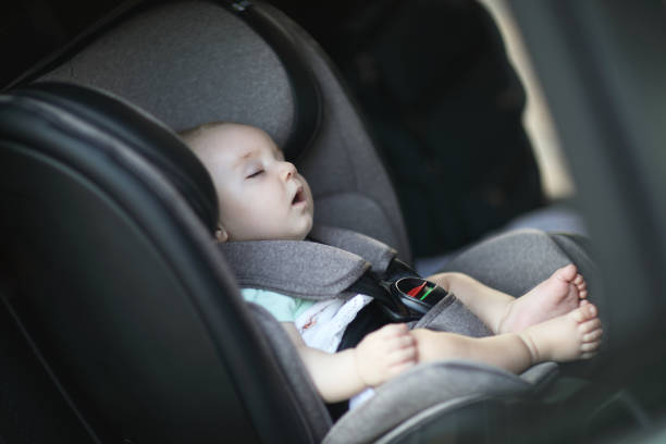 istock Baby sleeping in car safety seat while 1028486916