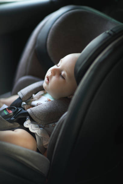 istock Baby sleeping in car safety seat while 1028486924