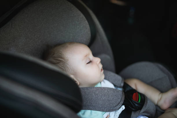 istock Baby sleeping in car safety seat while 1028489114