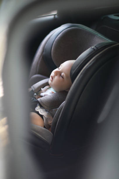 istock Baby sleeping in car safety seat while 1028489486