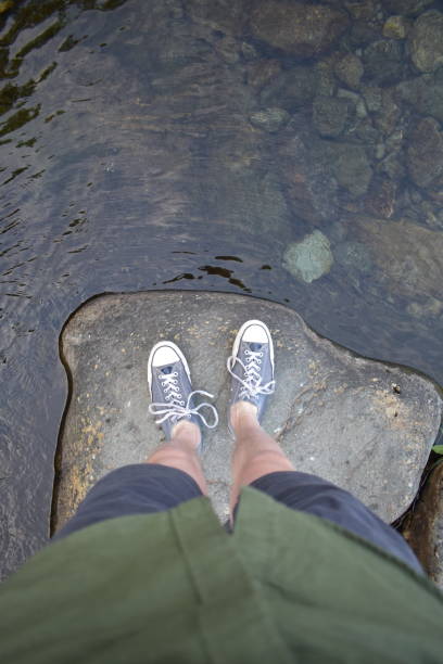 istock Standing on a rock next to a river 1028494346