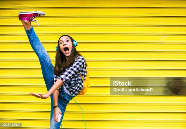 Beautiful Girl Dancing To The Music Stock Photo - Download Image Now - Teenager, Dancing, Child