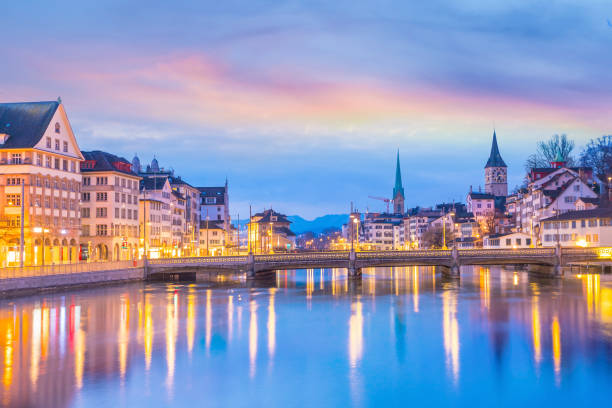 Cityscape of downtown Zurich in Switzerland Cityscape of downtown Zurich in Switzerland during dramatic sunset. switzerland zurich architecture church stock pictures, royalty-free photos & images