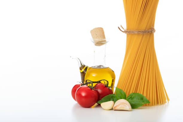 A bunch of raw spaghetti pasta on a white background