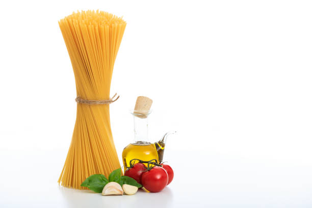 A bunch of raw spaghetti pasta on a white background