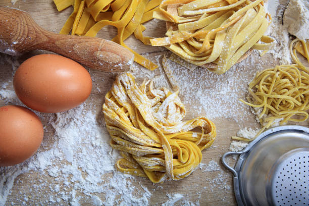 istock Fresh tagliatelle pasta homemade preparation 1028504836