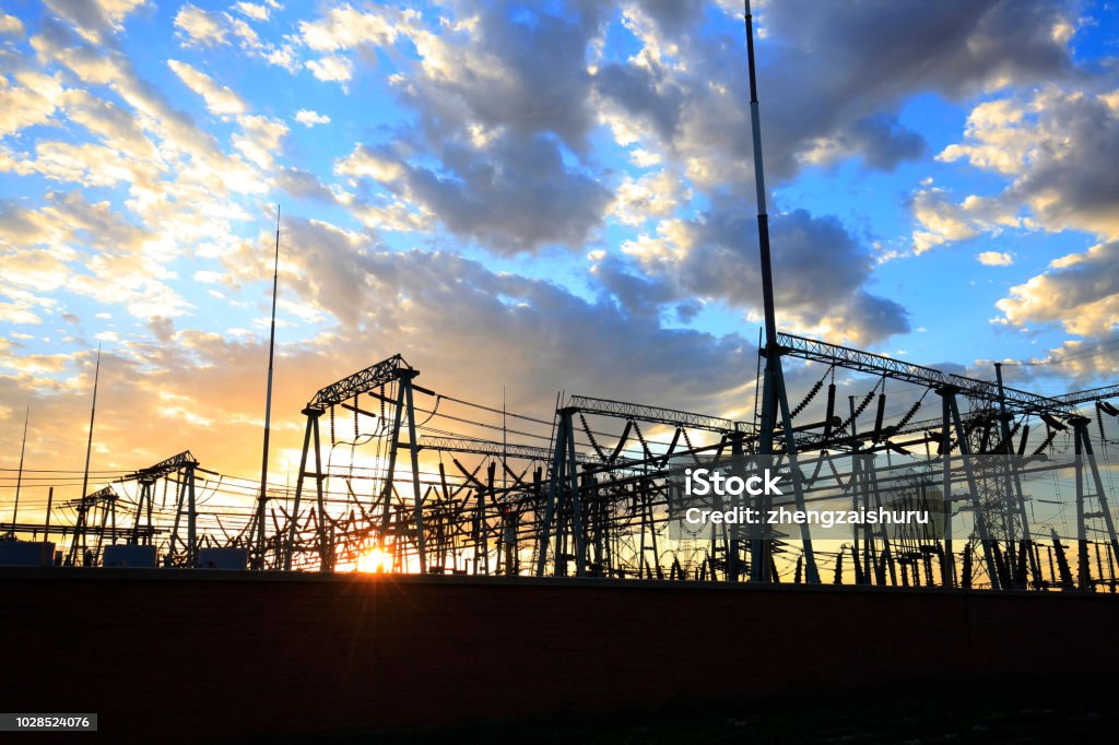 Substation in the evening, the silhouette of the power supply facilities Authority Stock Photo