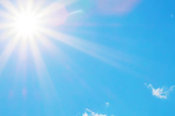 istock Sun with beautiful beams in the blue sky 1028531248