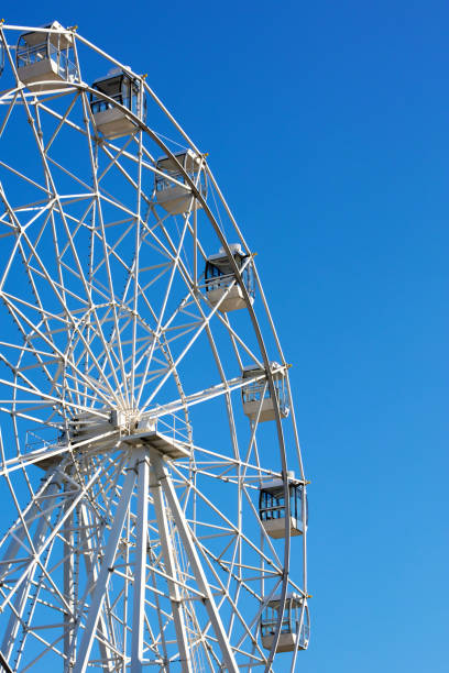 istock Ferris Wheel on a blue sky background 1028531778
