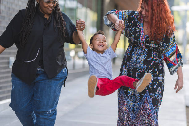 istock Female couple walking with their son 1028534566