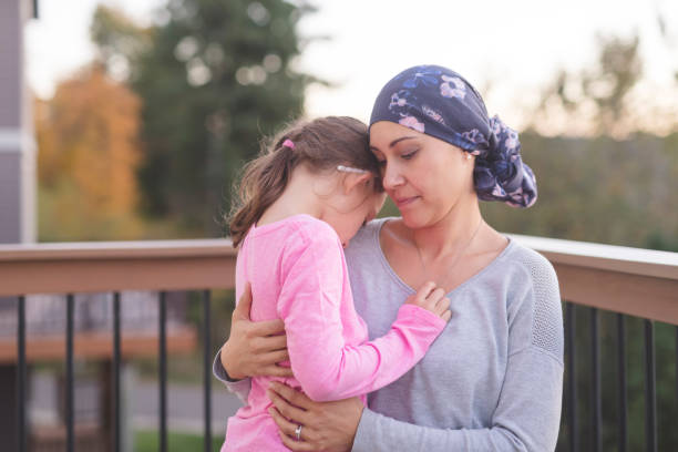 istock Mother with cancer hugging her daughter 1028537216