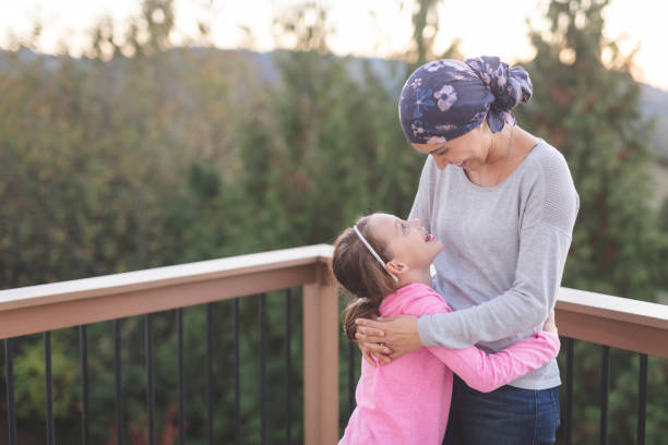 istock Mother with cancer hugging her daughter 1028537230