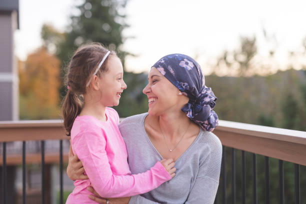 istock Mother with cancer hugging her daughter 1028537232