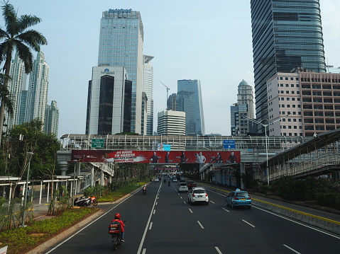 JAKARTA, INDONESIA - August 24, 2018: Traffic on Jalan Sudirman (Sudirman road).