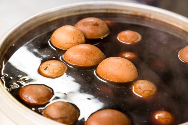 Traditional Chinese herbal tea eggs being prepared