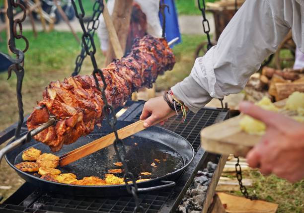istock meat roast over a grill, medieval style 1028540412