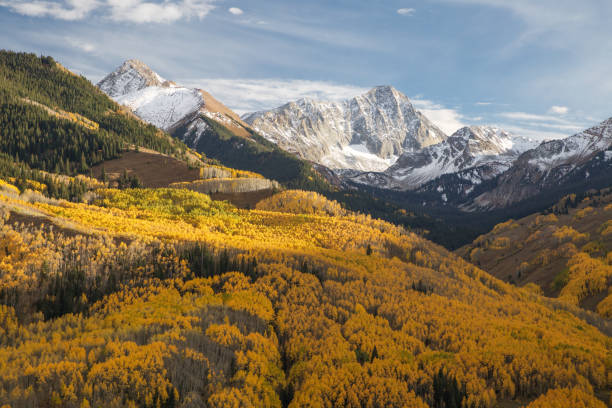 istock Autumn Colors with Mountains and Low Clouds in Autumn 1028542658