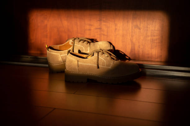istock shoes at doorway 1028555600