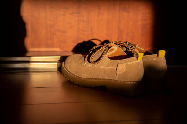 istock shoes at doorway 1028555604