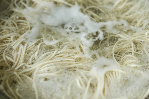 istock chinese noodle boiling in pot 1028572808