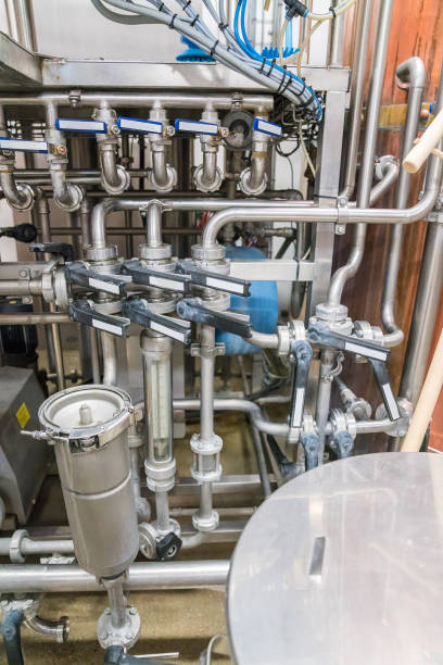 istock Valves and pipes in the brewery. 1028595986