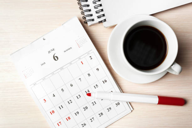 istock calendar on wooden table 1028596758