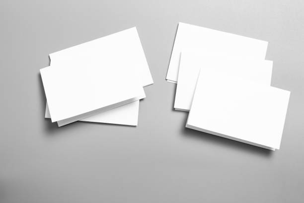 istock Blank portrait mock-up paper. brochure magazine isolated on gray, changeable background / white paper isolated on gray 1028596830
