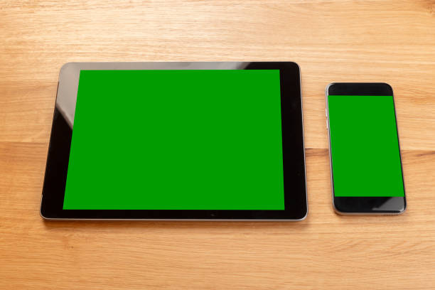 istock Smartphone and digital tablet on wooden desk 1028606476