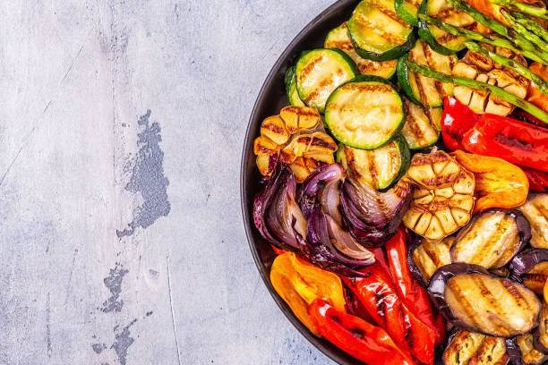 istock Grilled vegetables on a plate with sauce 1028606846