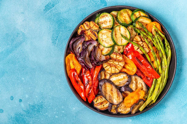 istock Grilled vegetables on a plate with sauce 1028607018