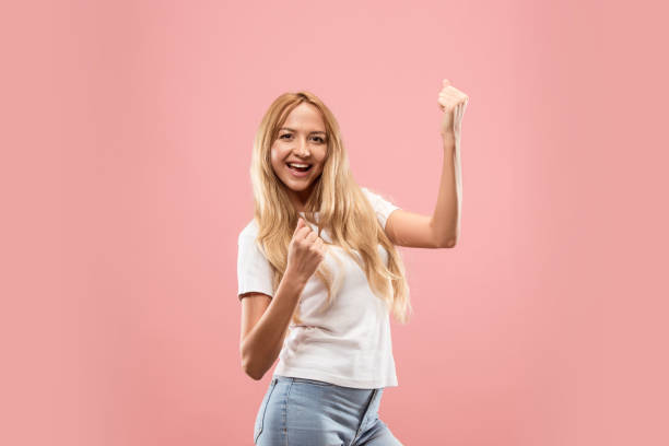 istock Winning success woman happy ecstatic celebrating being a winner. Dynamic energetic image of female model 1028609916