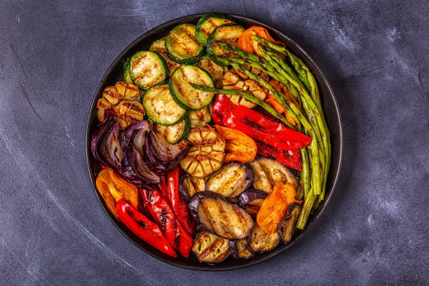 istock Grilled vegetables on a plate with sauce 1028610066