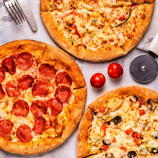 istock Set of different pizzas - pepperoni, vegetarian, chicken with vegetables 1028612600