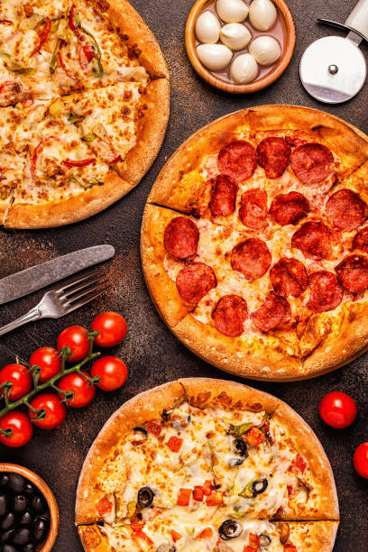istock Set of different pizzas - pepperoni, vegetarian, chicken with vegetables 1028612698