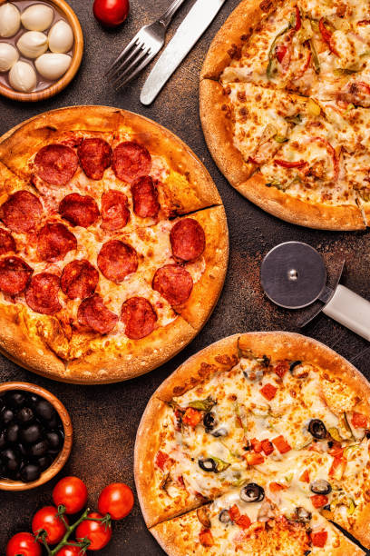 istock Set of different pizzas - pepperoni, vegetarian, chicken with vegetables 1028612768