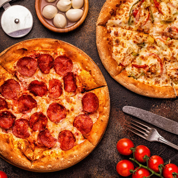 istock Set of different pizzas - pepperoni, vegetarian, chicken with vegetables 1028612784