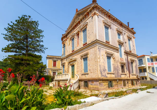 LESVOS ISLAND, GREECE - AUGUST 2017: Typical colorful Mediterranean style mansion, built in classical style in Mytilene town in Lesvos island, Greece against a clear blue sky.