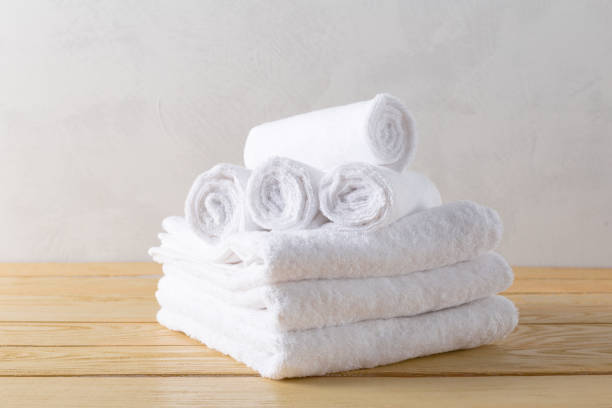 istock spa towels on wooden surface 1028616704