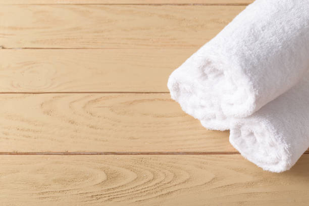 istock spa towels on wooden surface 1028617328
